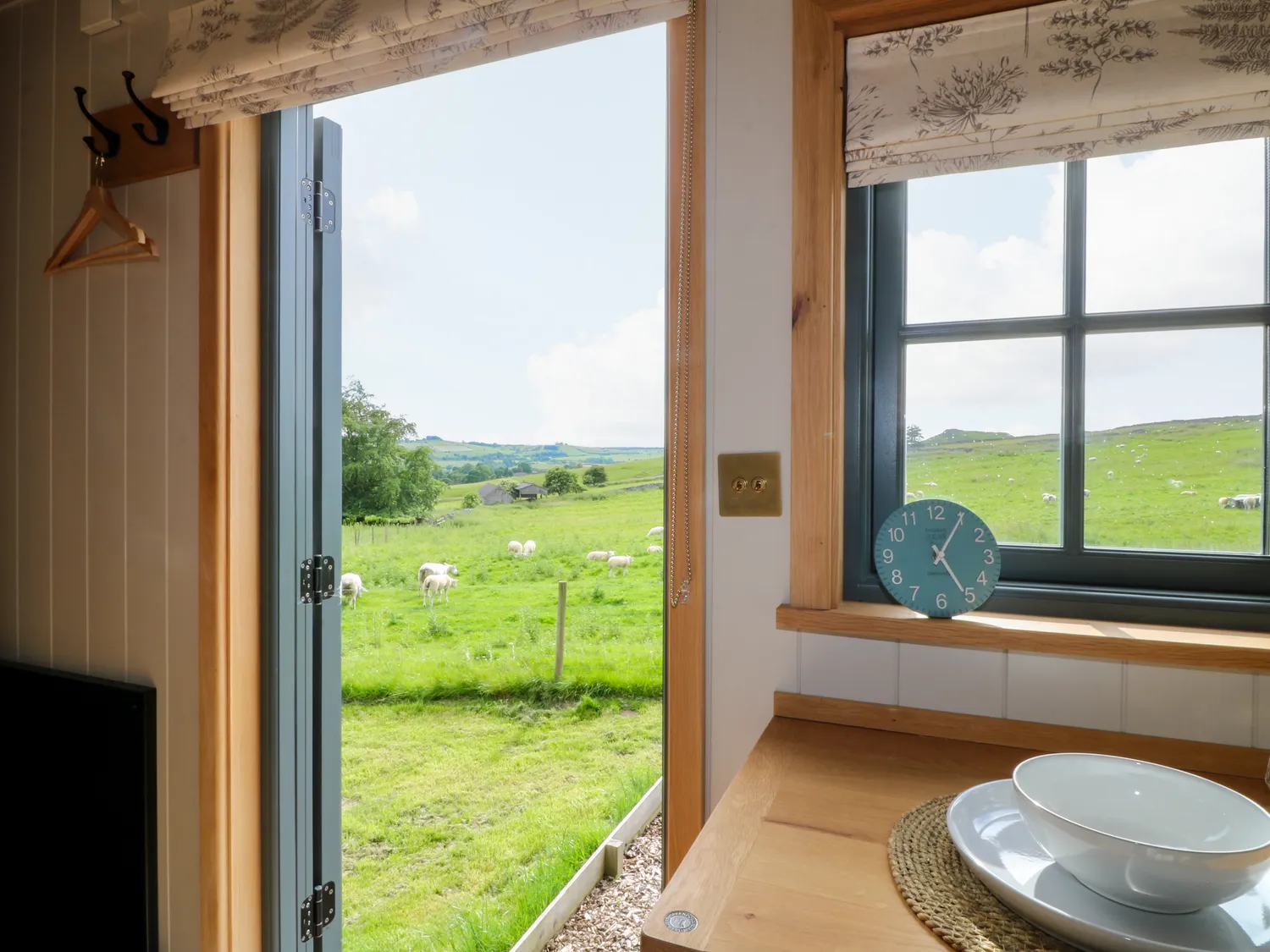 The open doorway and countryside view from Fern