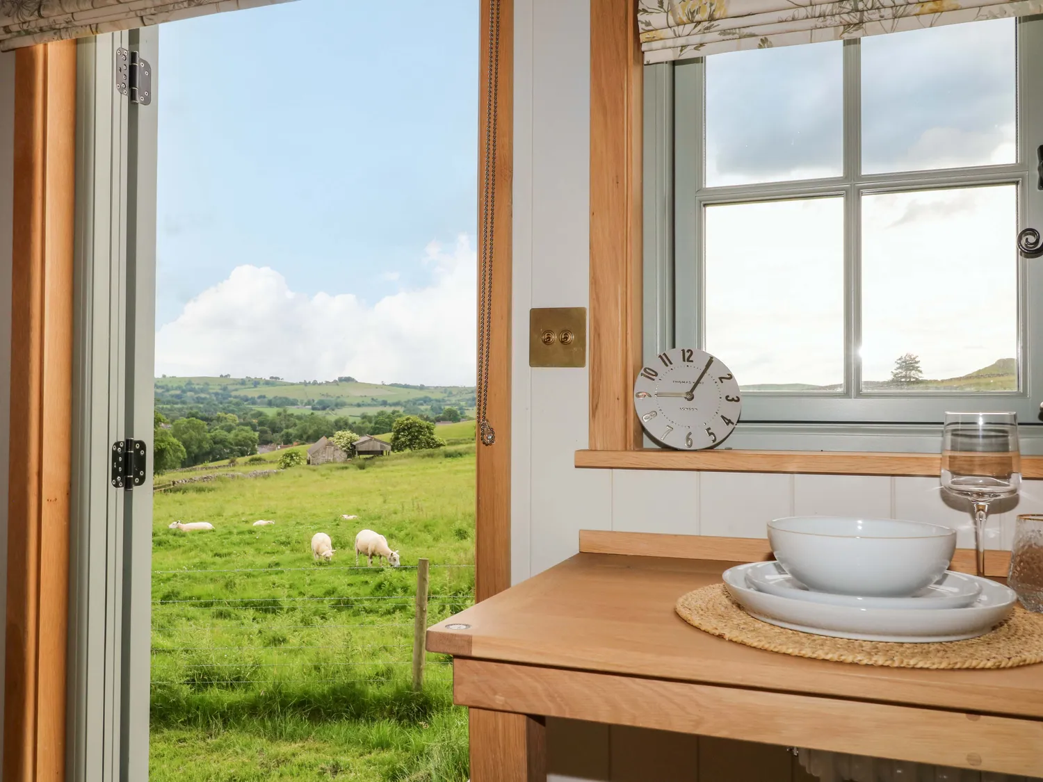 The warm interior and open countryside view from Meadow